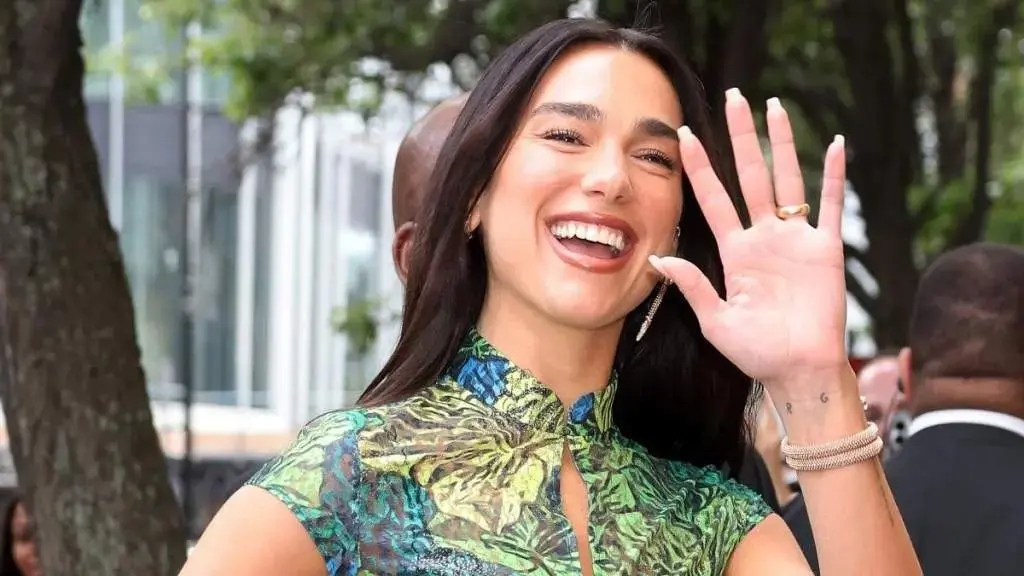 Dua Lipa Stuns in Bold Micro Minidress and Sheer Skirt at Paris Show