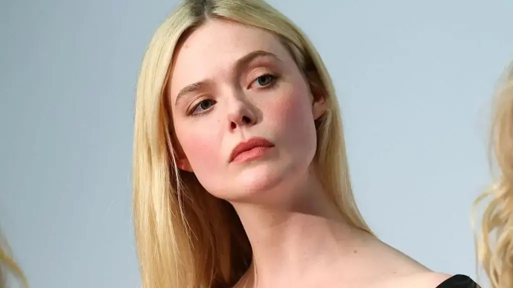 Elle Fanning Dazzles in Plunging Gown and Cartier Jewels
