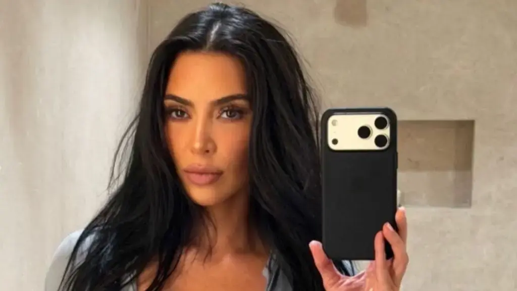 Kim Kardashian Shows Bra in Unbuttoned Shirt