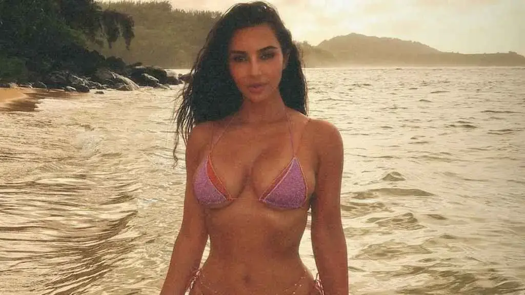Kim Kardashian Shows Off Cheeky Style in See-Through Skirt on Beach Getaway