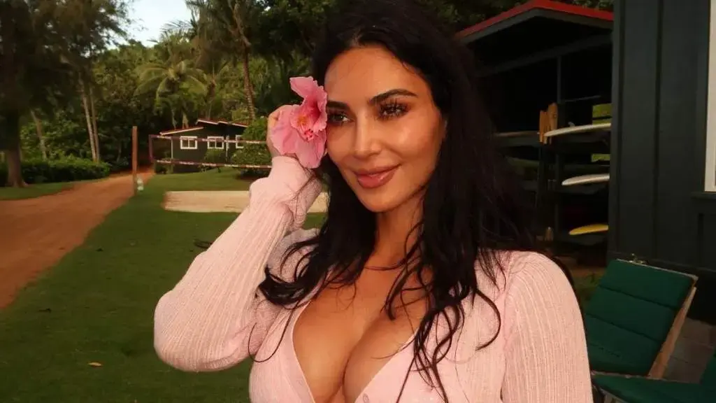 Kim Kardashian Stuns in Black Bralette Under Sheer Yellow Cardigan