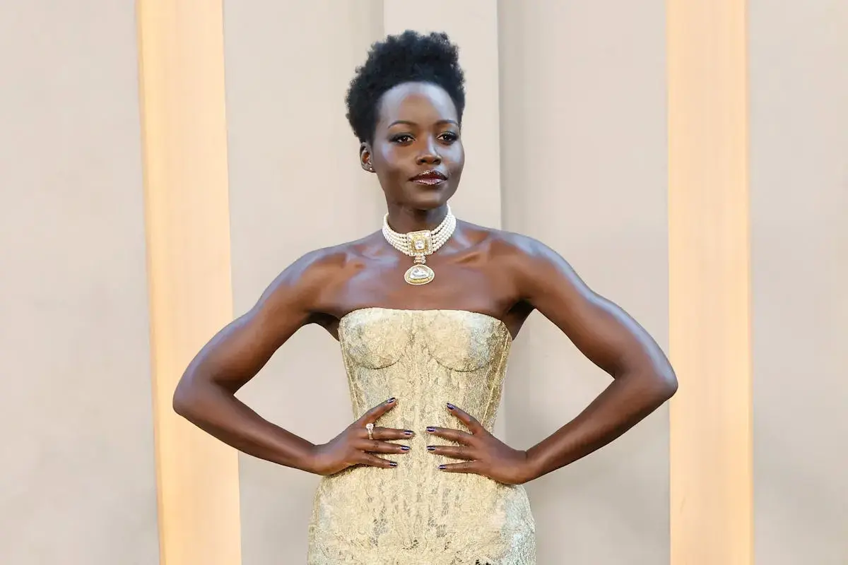 Lupita Nyong'o Shines in Golden Gown at NYC Premiere