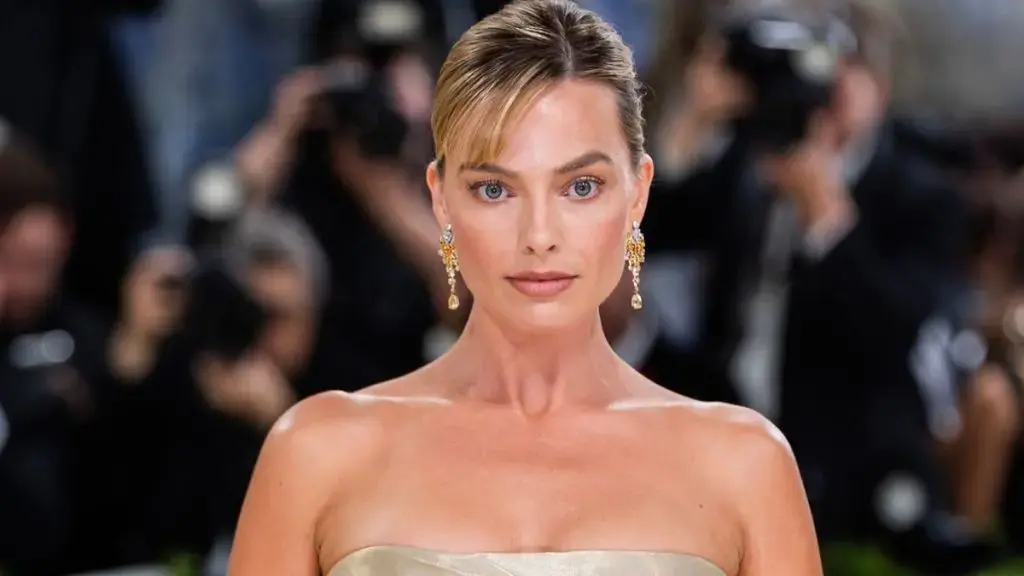 Margot Robbie Elevates Simple Minidress with Chic Chanel Accessories in Paris