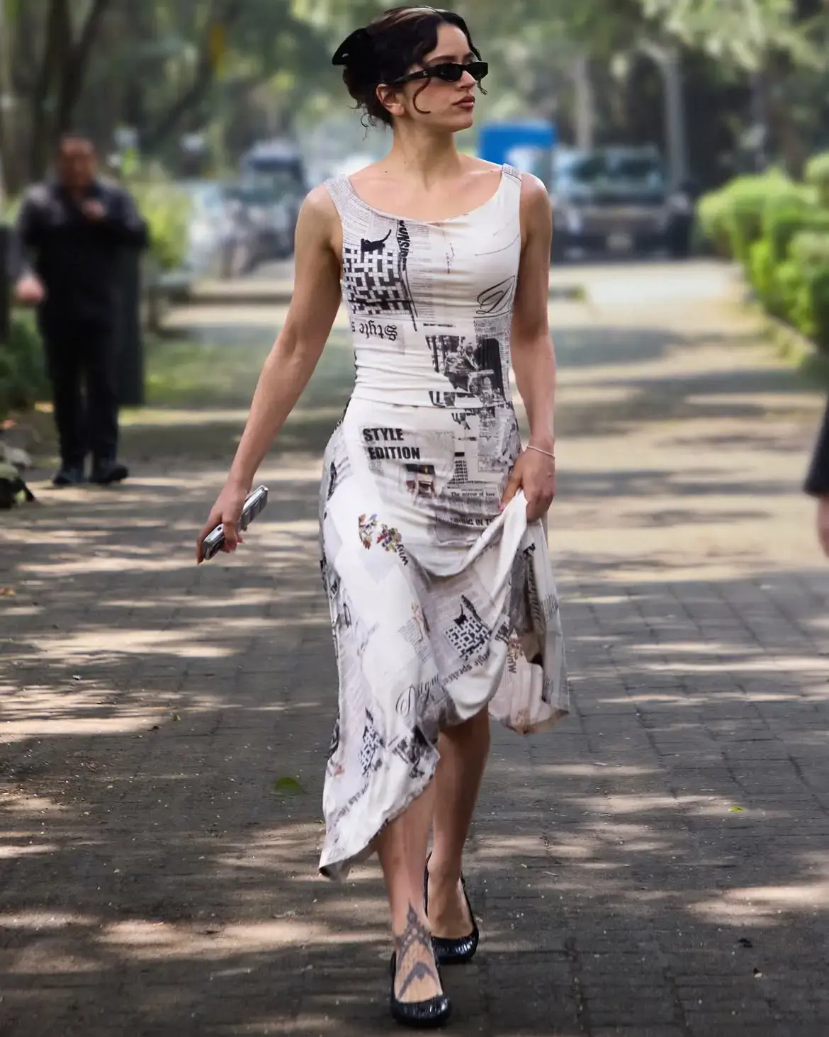 Rosalia Wears Bold Newspaper Print by Barcelona Brand Desigual