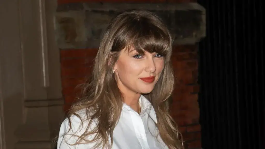 Taylor Swift Showcases Effortless Style with Miu Miu Shirt and Pleated Pants
