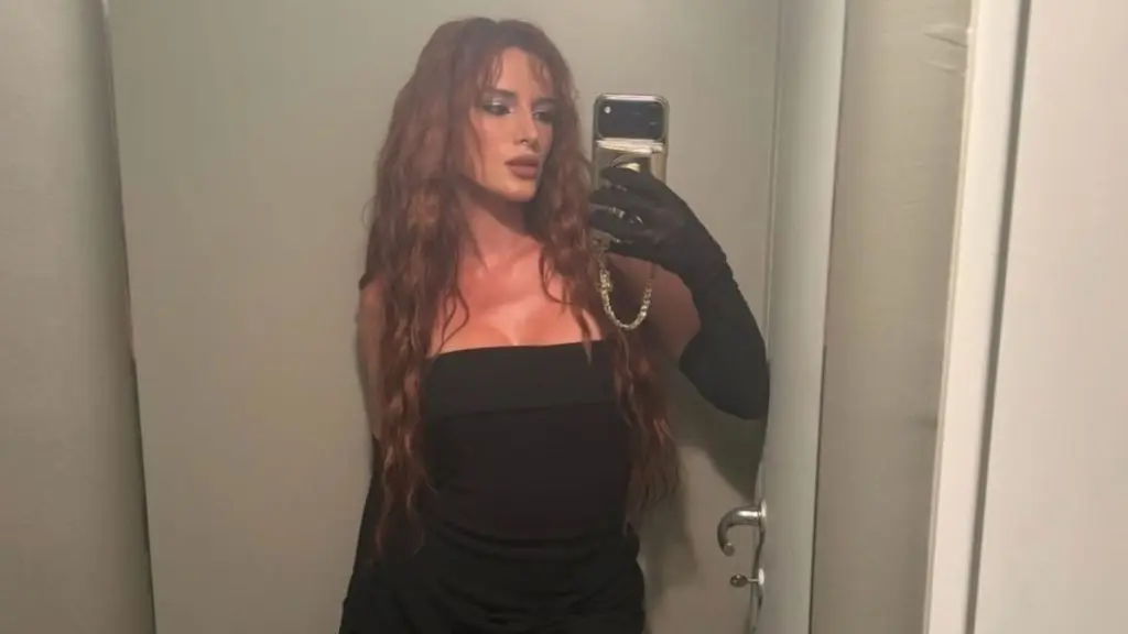 Bella Thorne Shines in Silver Mini Dress at Milan Fashion Week