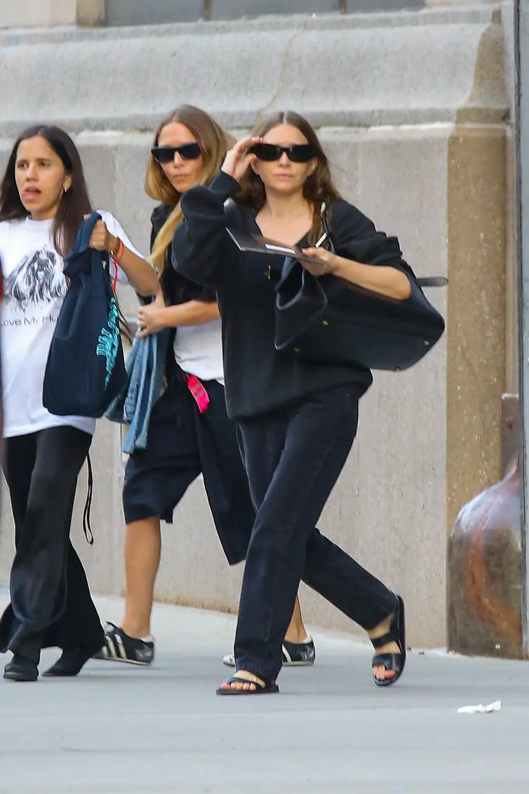 Olsen Sisters Show Opposing Views on Transitional Fashion Trends