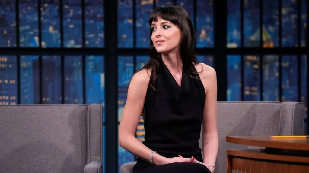 Dakota Johnson Stuns in Minimalist Black Gown on Late Night Television