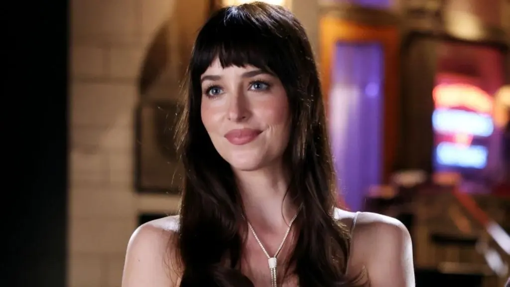Dakota Johnson Turns Heads in Daring Lace Top for Saturday Night Live Promo