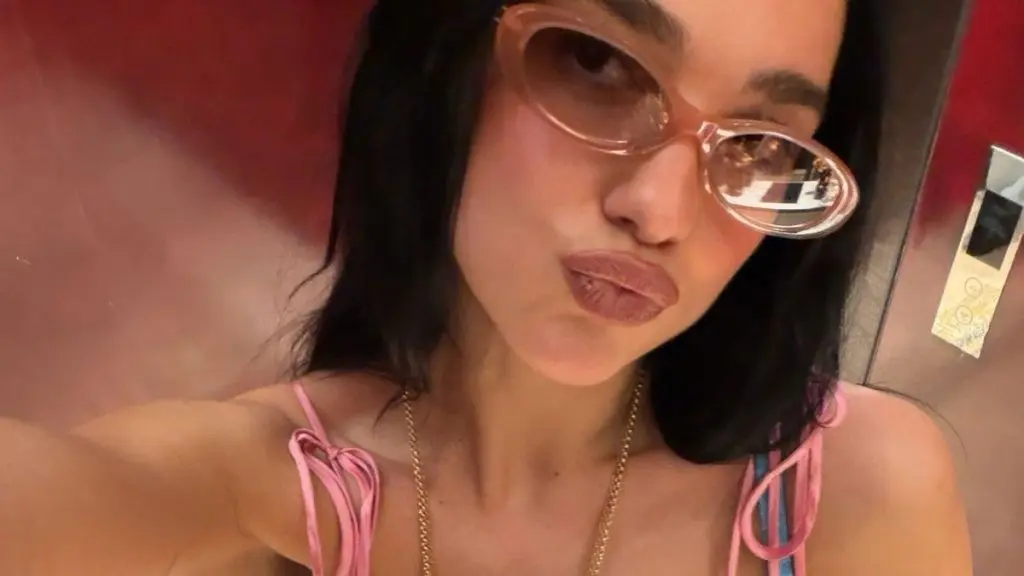 Dua Lipa Stuns Paris Fashion Scene in Daring Silk Top
