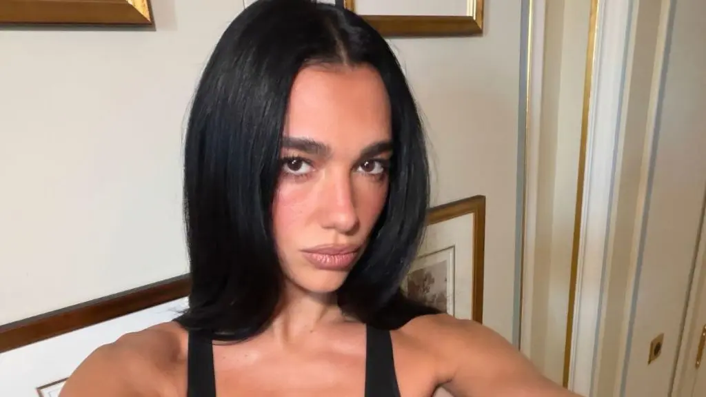 Dua Lipa Stuns Paris Fashion Week in Bold Purple Sheer Bodysuit
