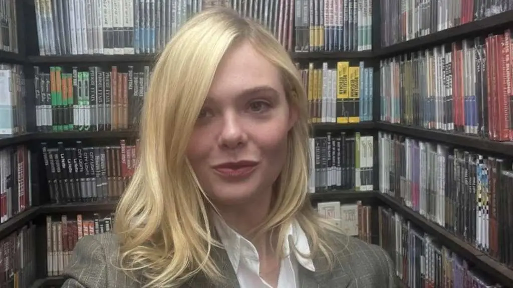 Elle Fanning Stuns in Sheer Coach Mini at Hunger Games Press Event