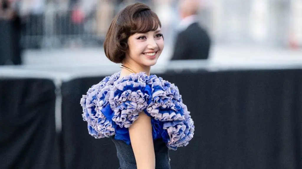 Lisa Rocks Paris Fashion Week With Bold Pink Tweed Ensemble